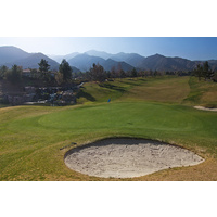 Glen Ivy Golf Club's opening hole is a downhill par 5 that plays shorter than the yardage of 550 yards. There is a water hazard guarding the right side of the green.