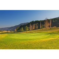 Glen Ivy Golf Club's eighth hole is a dogleg left par 4. Three sand bunkers protect the split-level green.