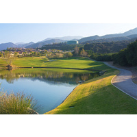 A mountain lake and orange groves on the right make Glen Ivy Golf Club's 14th hole very memorable.